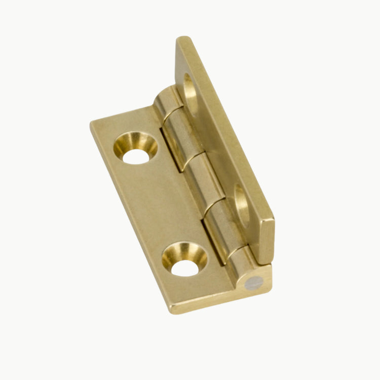 Brass metal hinge on a white background